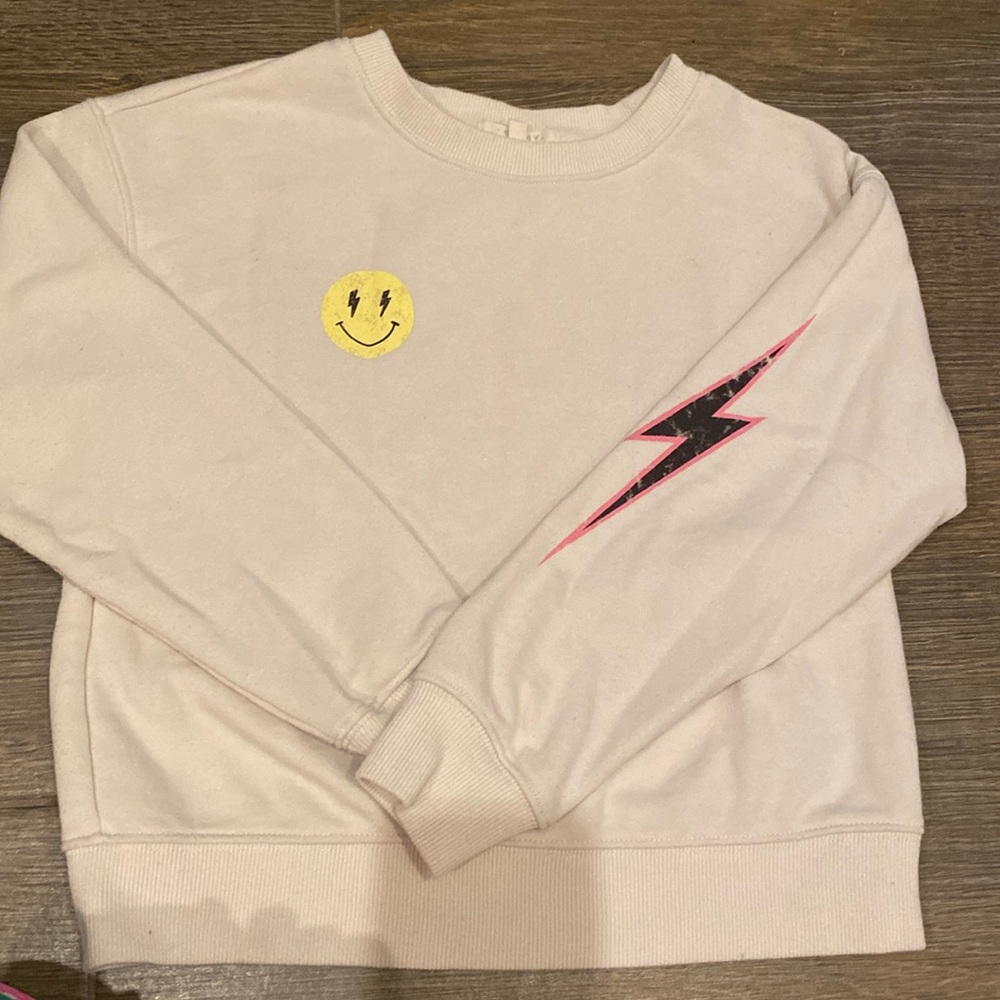 Girls sweatsuit cream with yellow smiley face and pink lightning on sleeve/leg